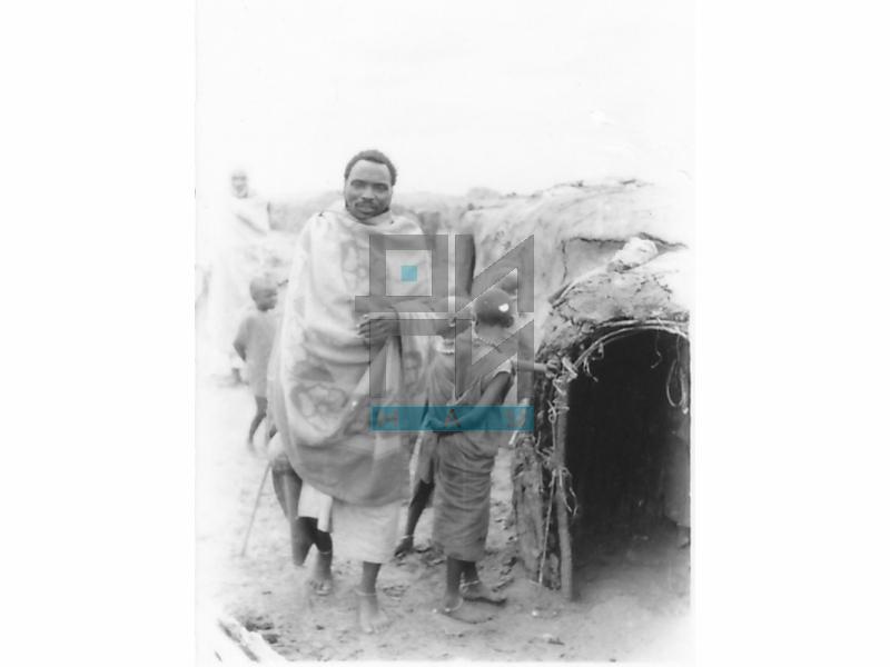 A Maasai Warrior in front of His House (VZP.N.190-26)
